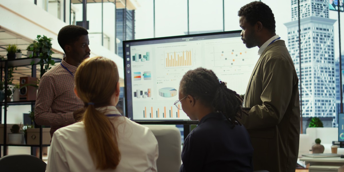 PR team strategizing in front of a screen.